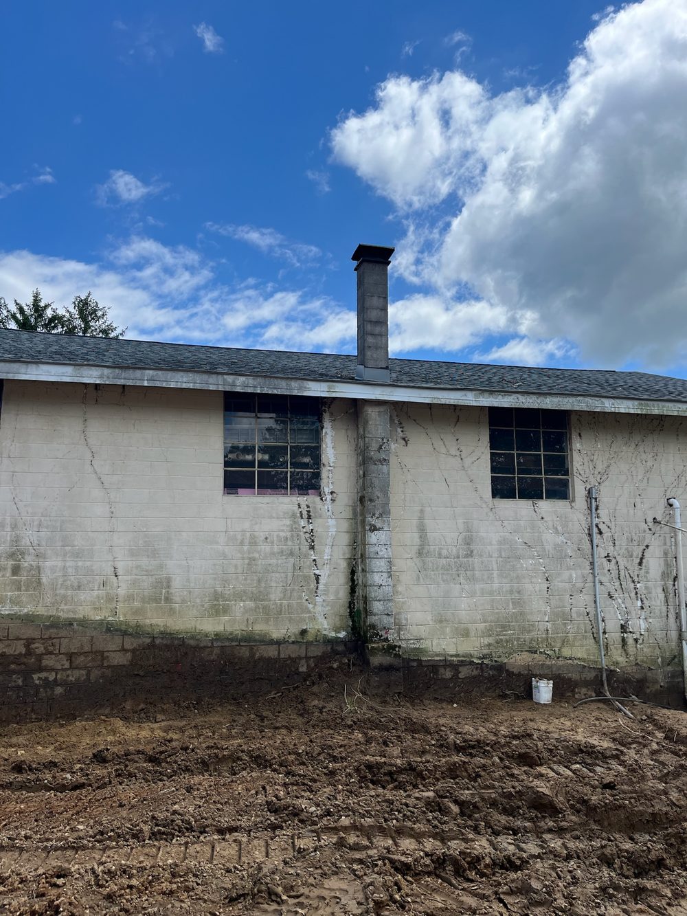 Site graded down to a building foundation, cut and leveled by Beckage in NJ